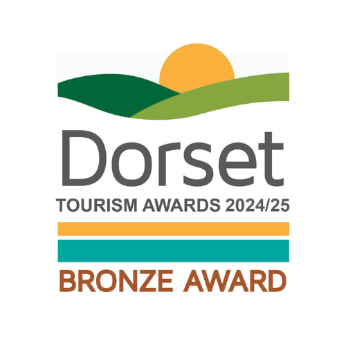 The Dorset Tourism Awards 2025 logo. Text underneath says bronze award