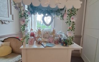 A retro themed sweet cart with jars of sweets